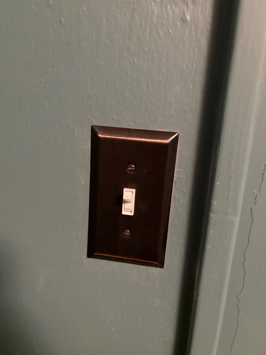 Light switch relocated to the outside of a walk-in closet in a St. Paul, MN home.